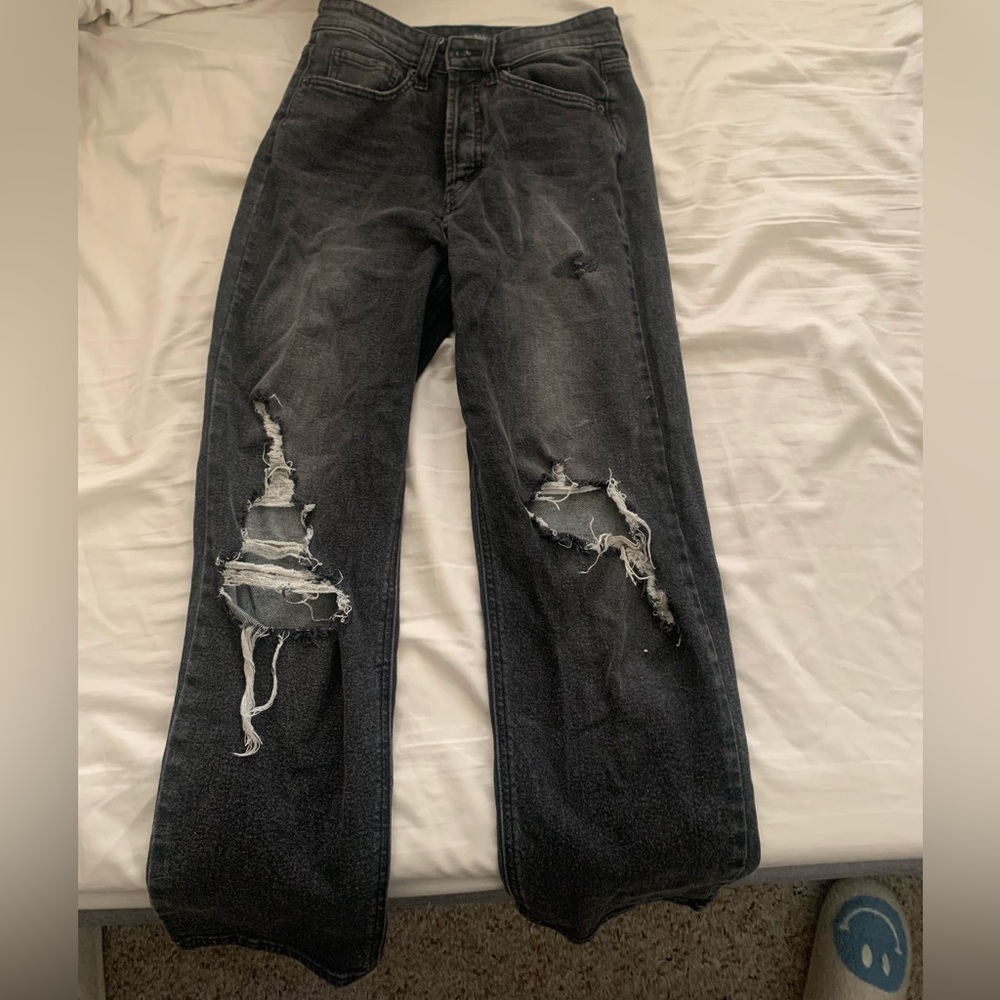 Washed out black ripped denim jeans